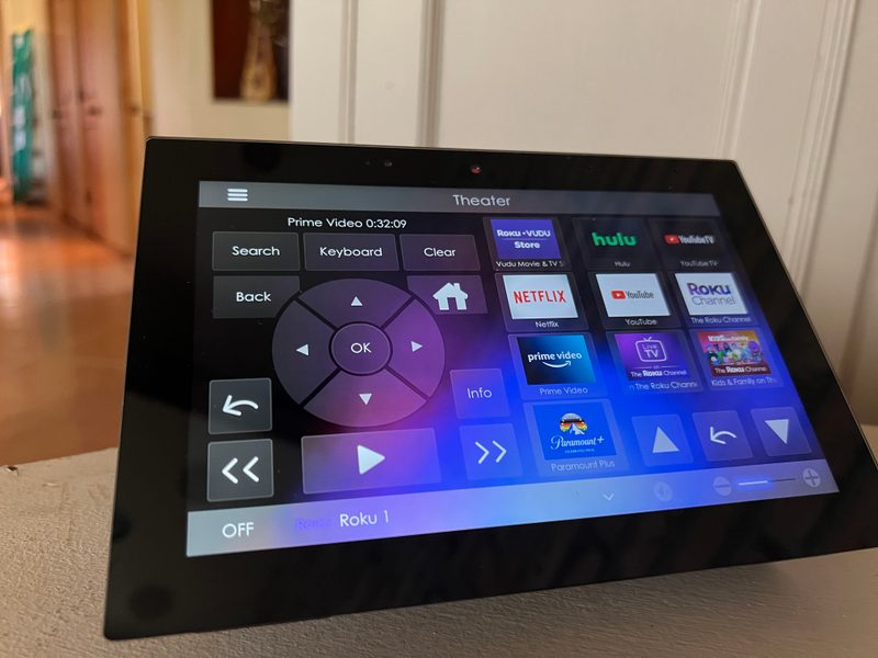 Control4 touchscreen dashboard showing theater and streaming apps for Tucson smart home