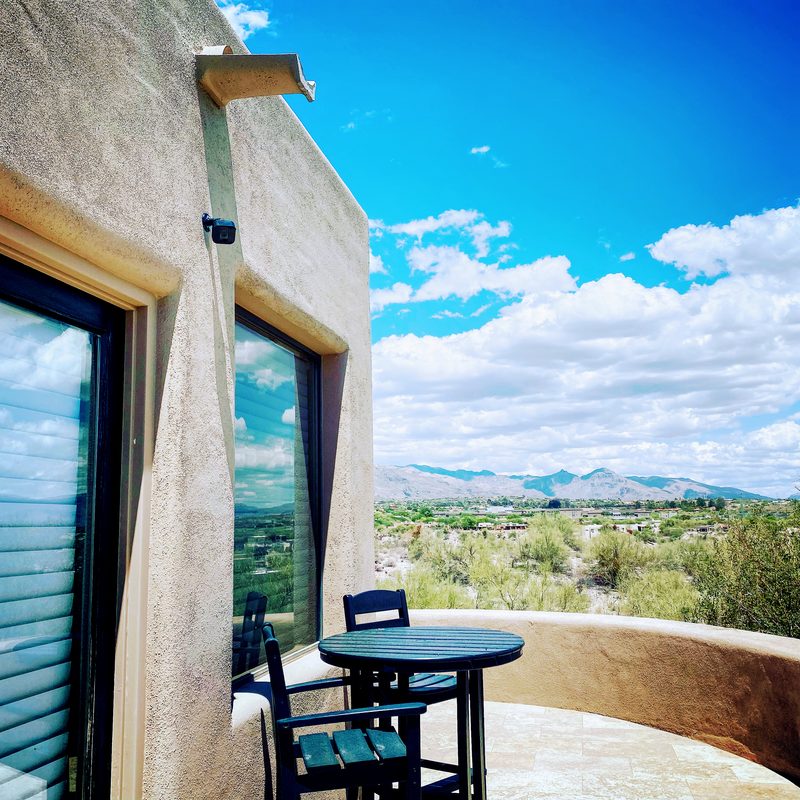 Outdoor security camera with Tucson mountain view from property balcony