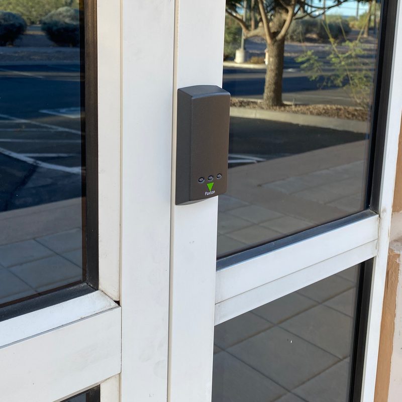 Paxton card reader installed on glass door by Onora Systems in Tucson